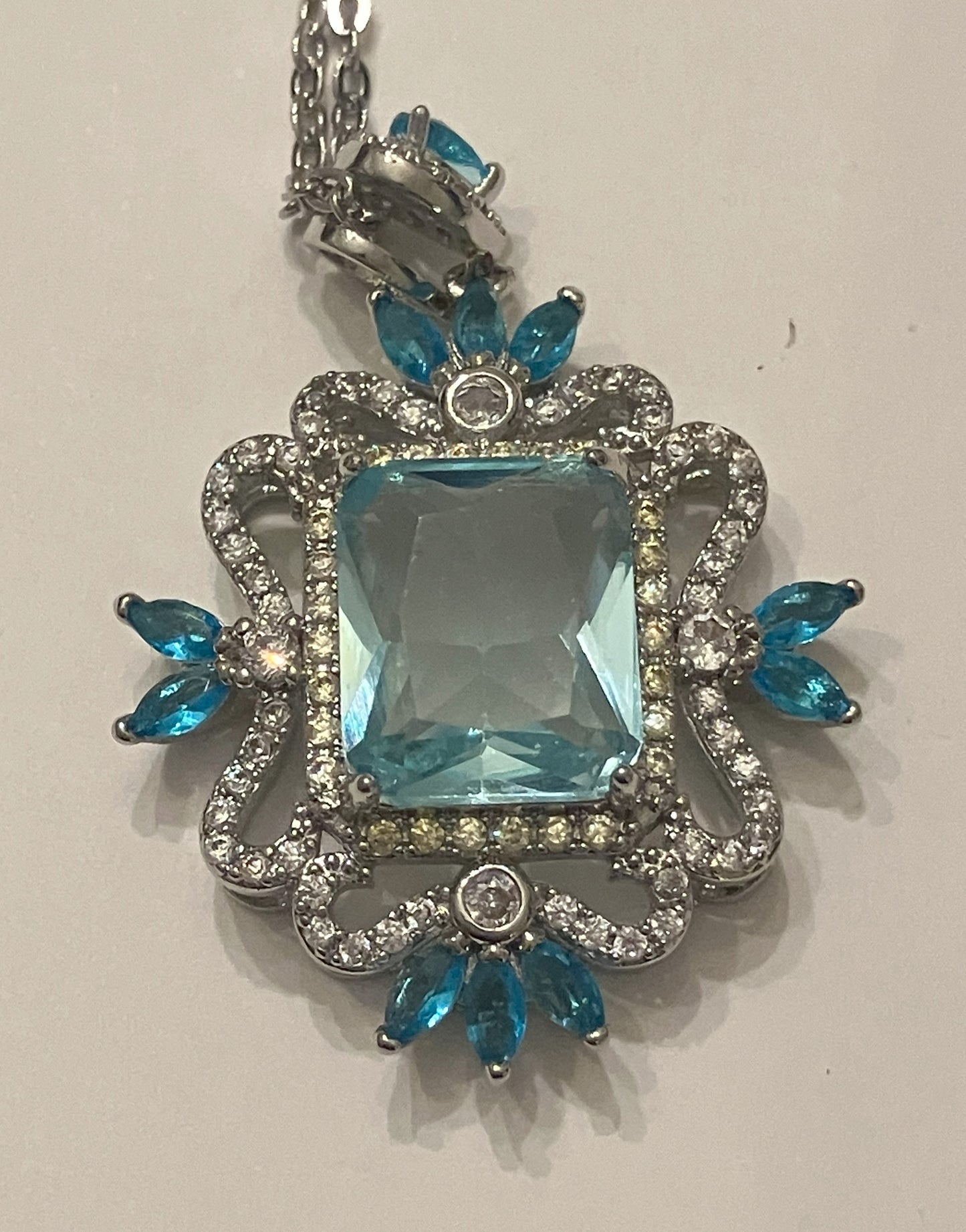 square blue gemstone pendant