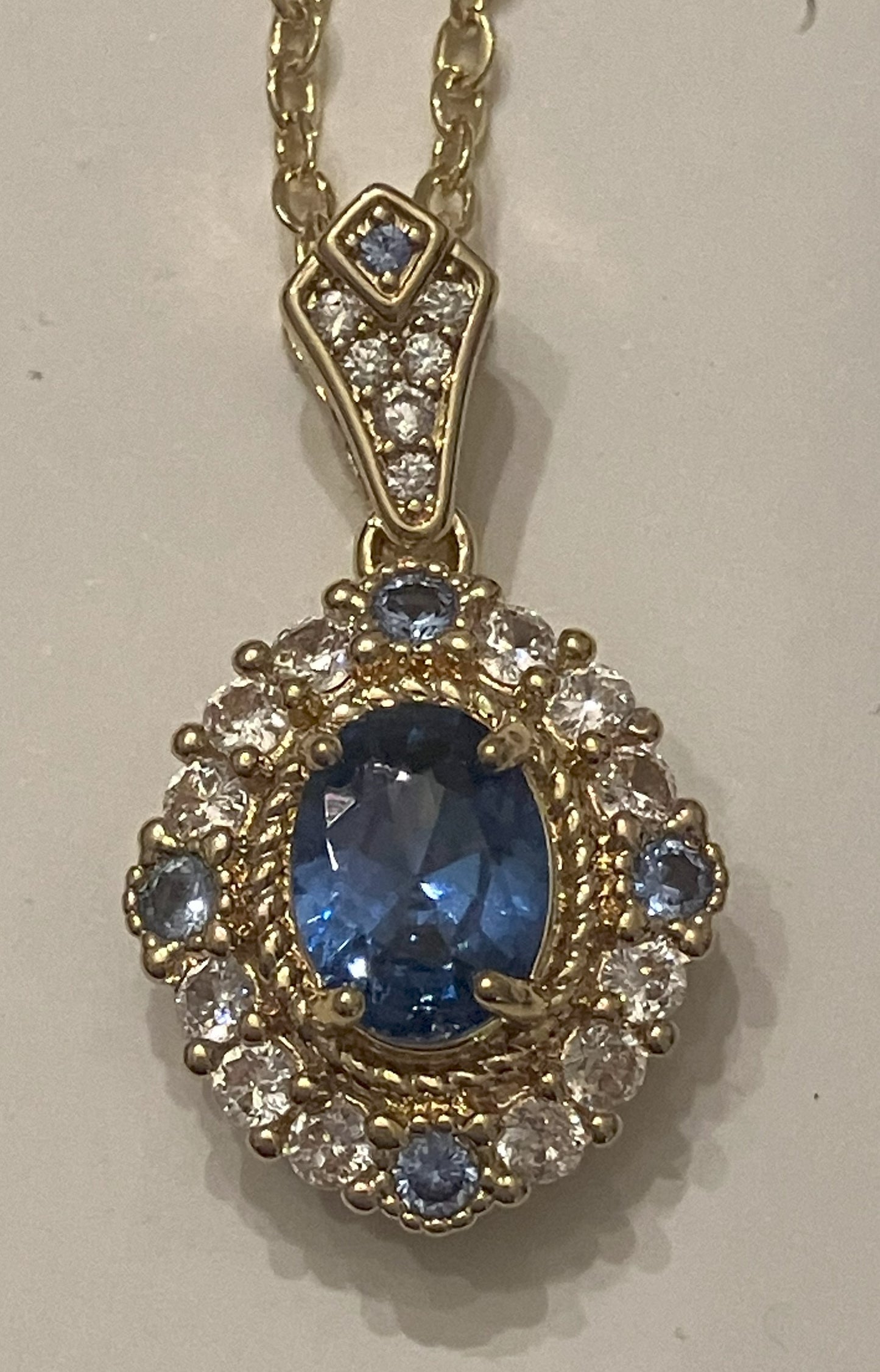 Oval deep blue gemstone pendant