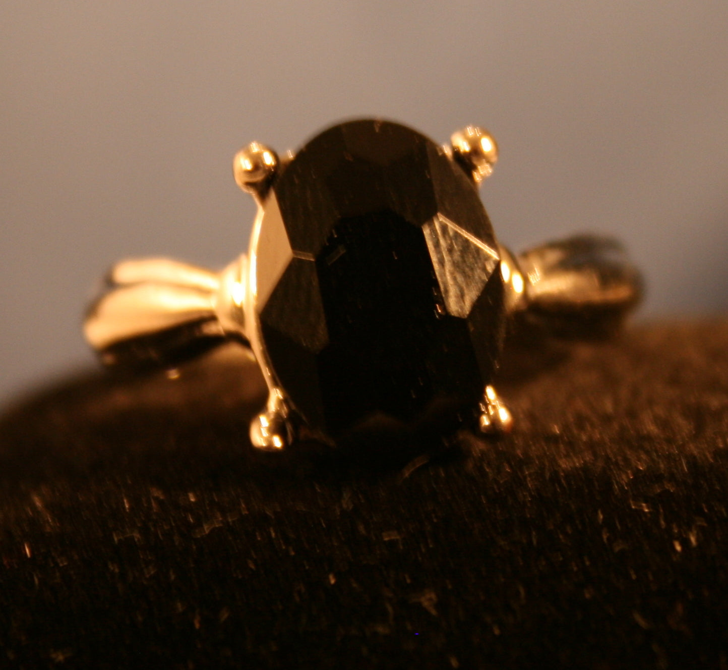 Black/Purple Oval gemstone in 4 prong setting