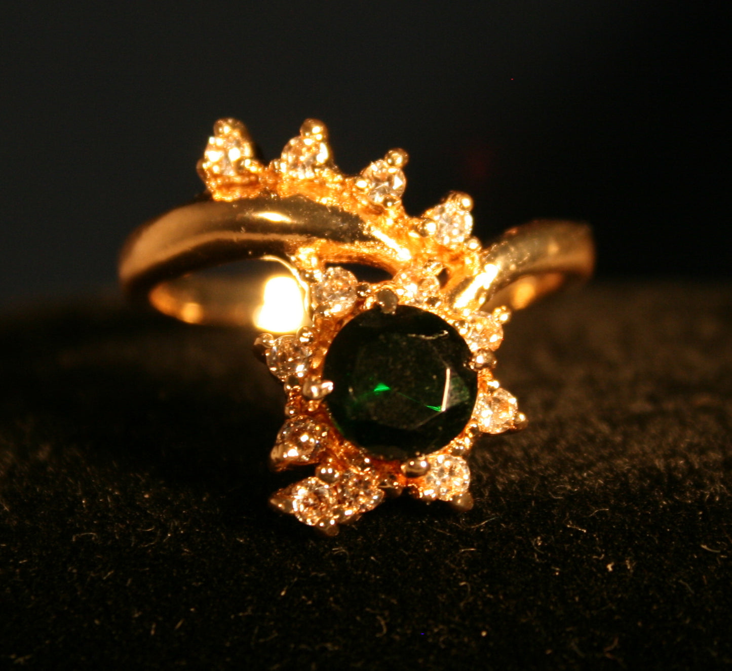 Floral design with green gemstone