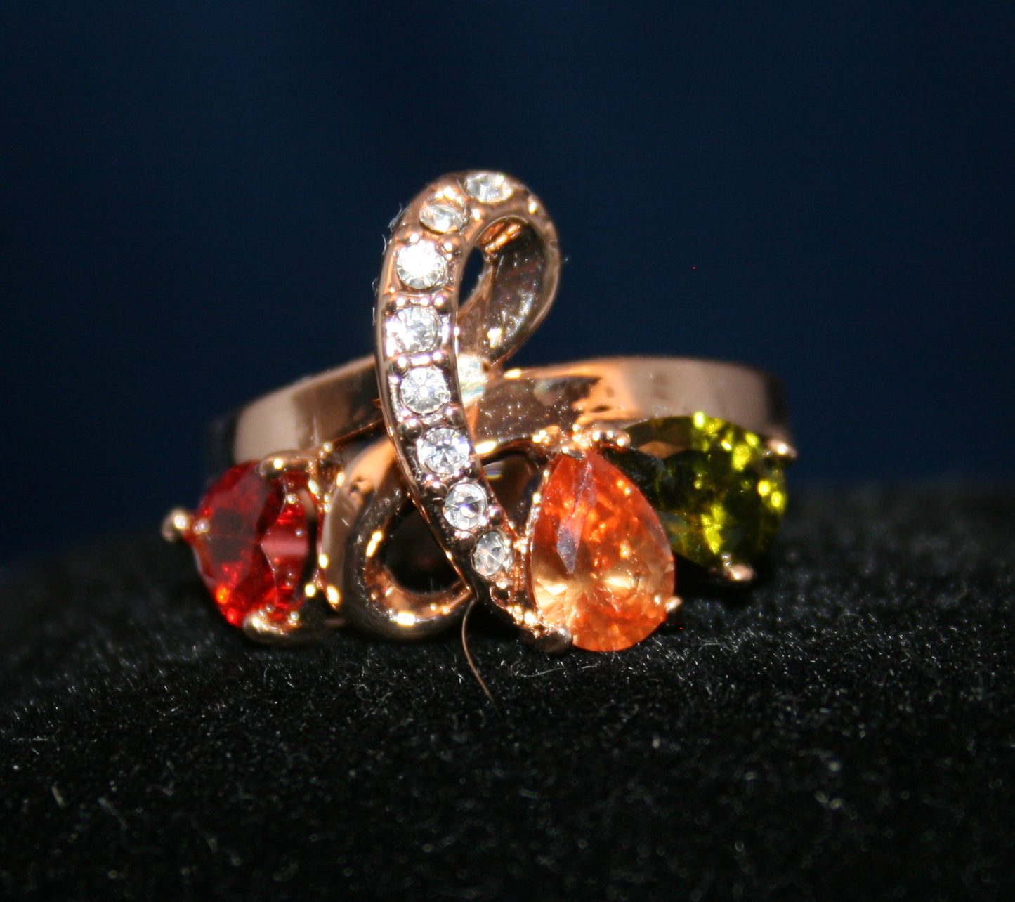 teardrop-shaped gemstones in red, orange, and green colors
