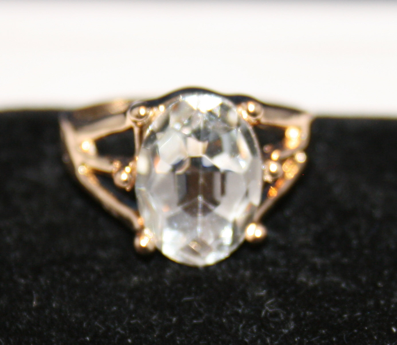 large, clear oval-shaped, faceted gemstone
