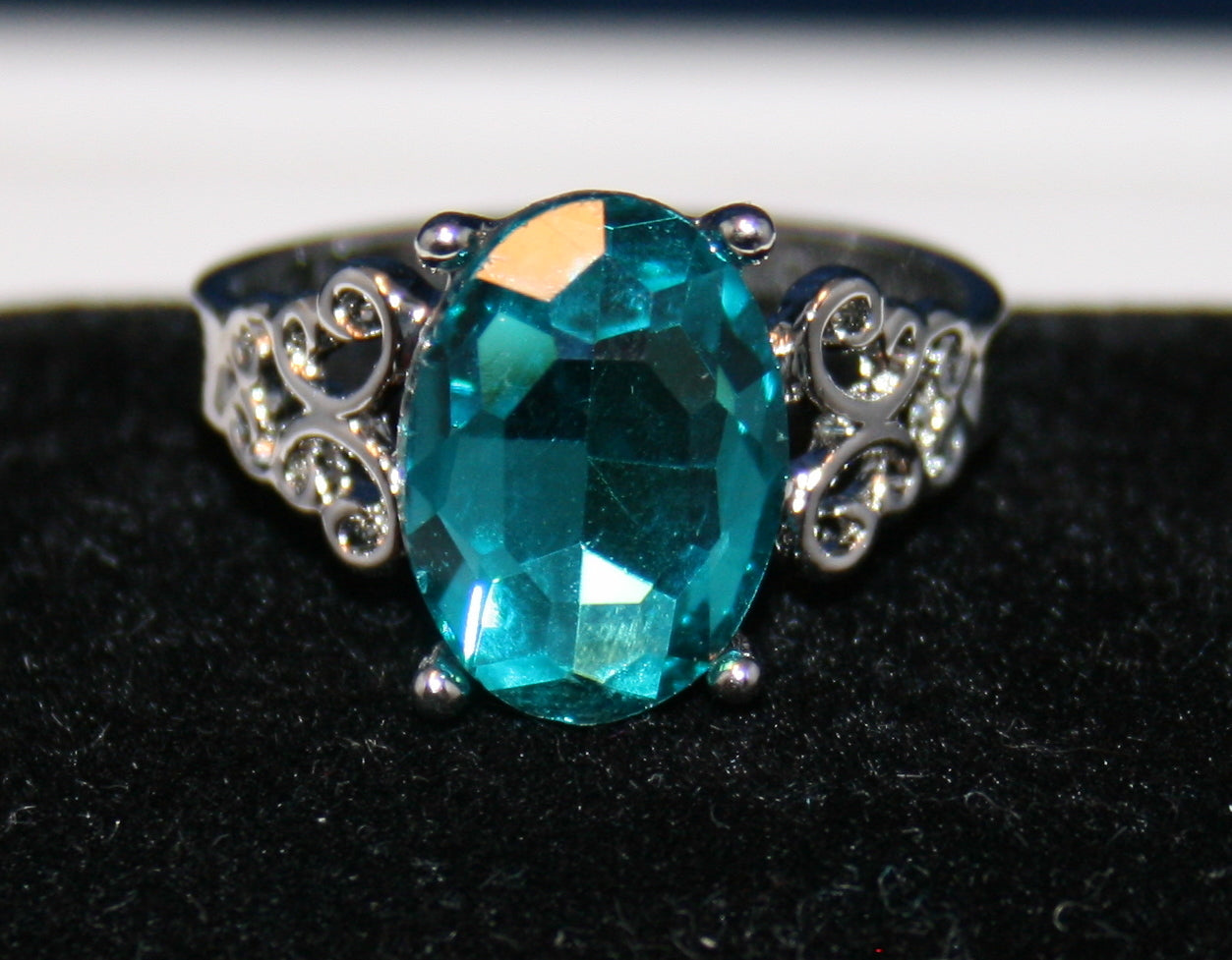 oval-cut, faceted blue gemstone