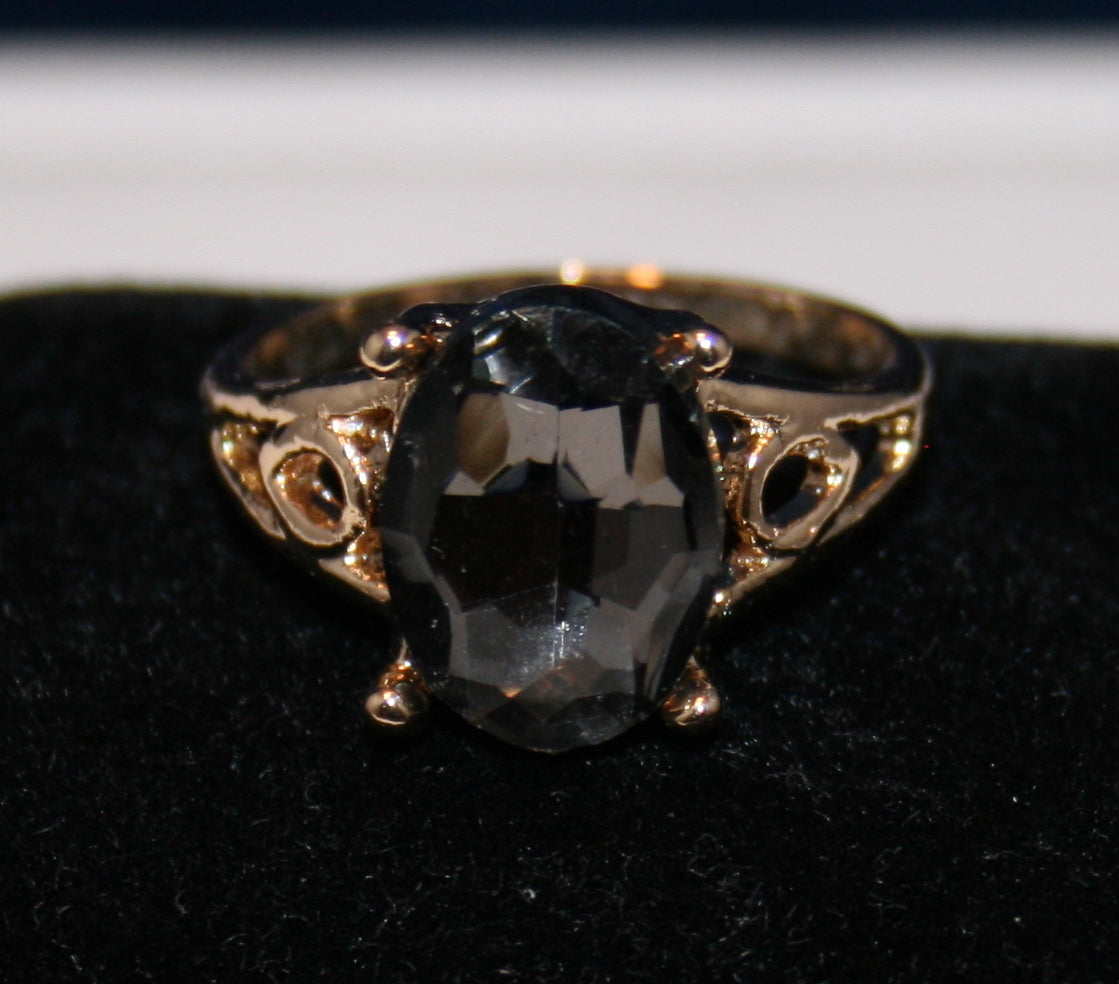 oval grey faceted stone