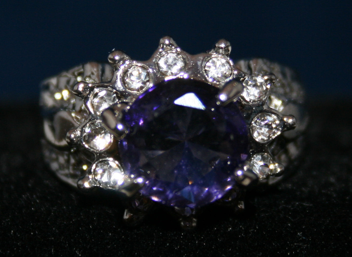 large central Purple gemstone Flower setting