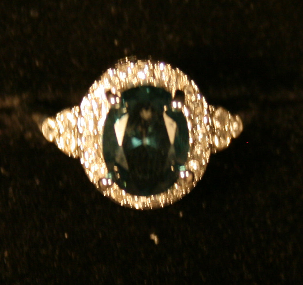 Oval Green gemstone with Oval surround